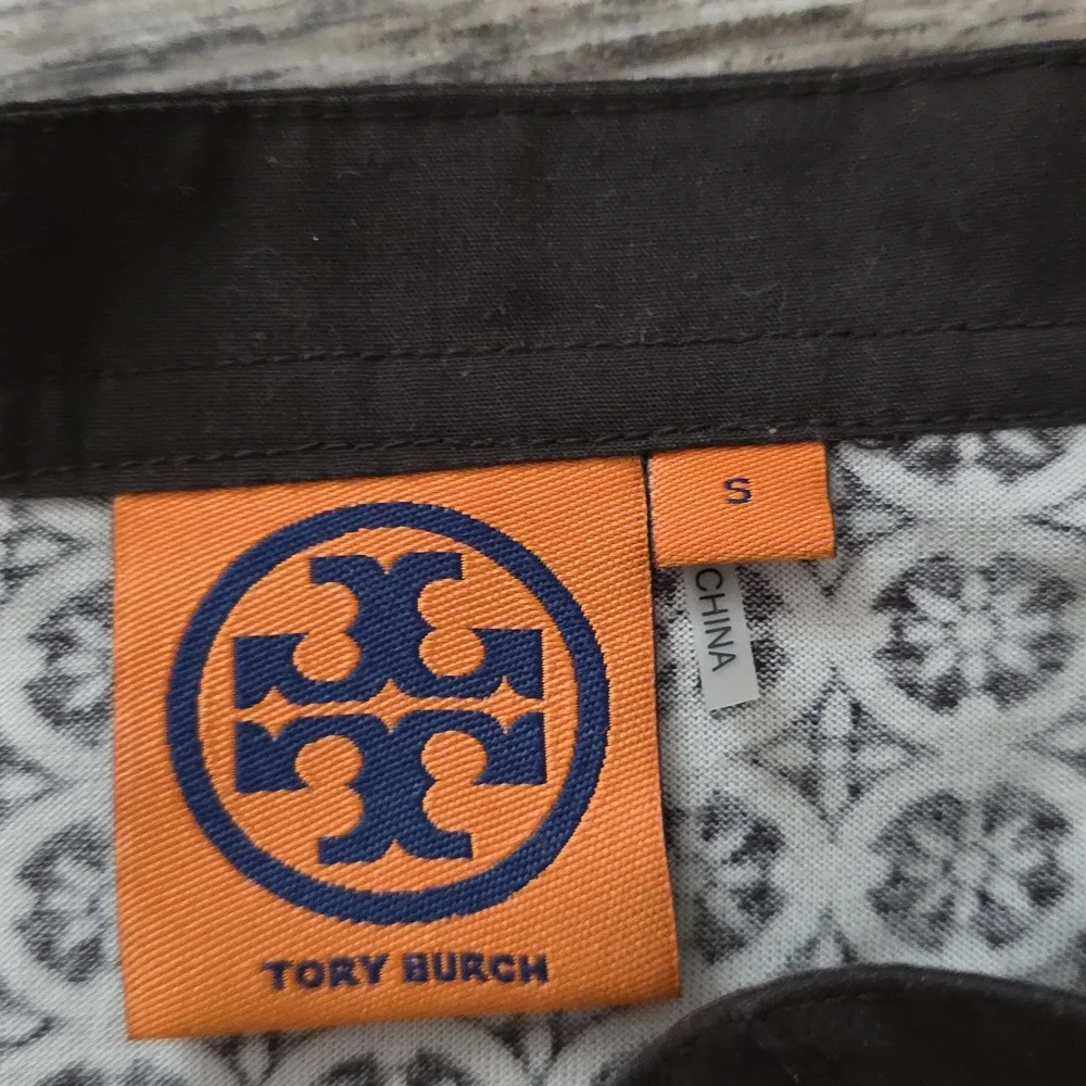 Tory Burch printed tunic top featuring a split neckline and long sleeves